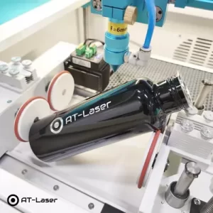 Lasergravyr på lackerad flaska